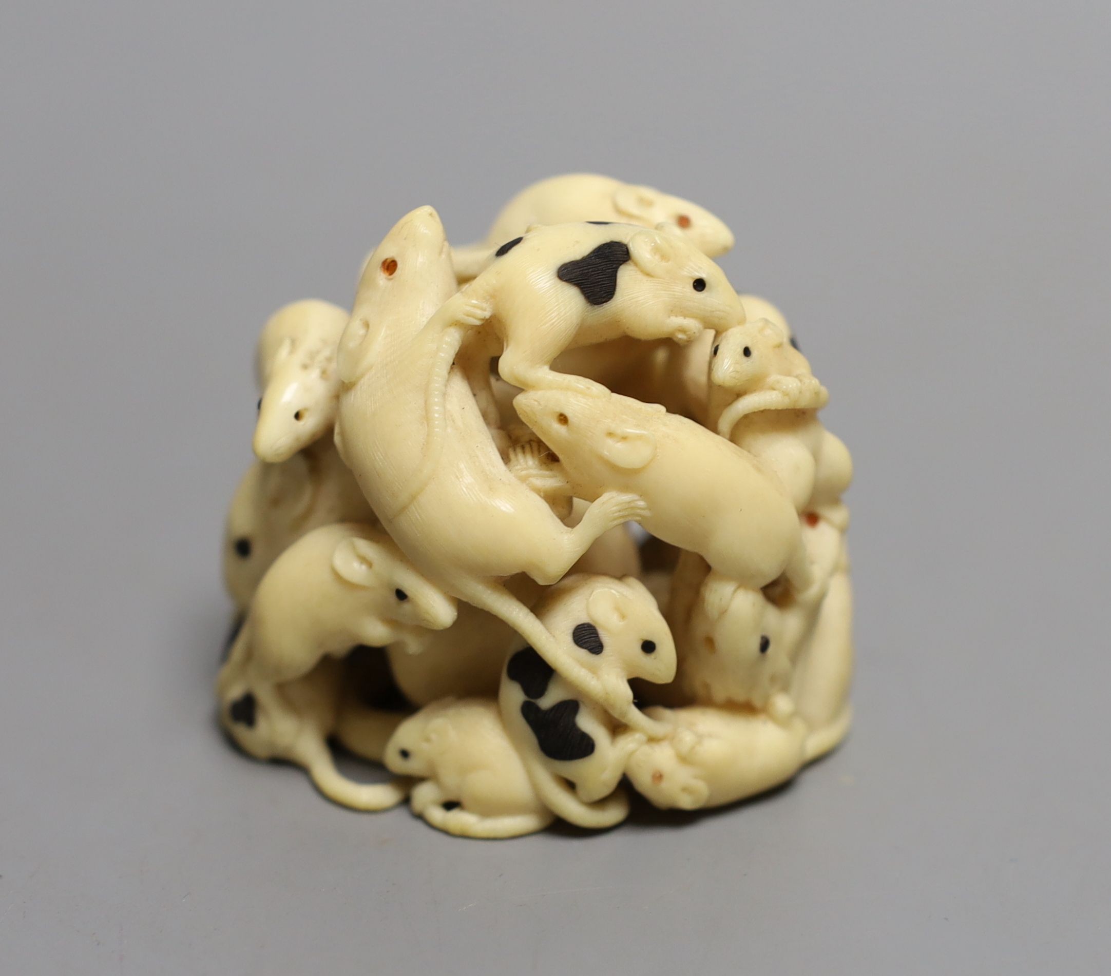 A fine Japanese carved ivory Okimono of a “mischief “ of rats, Meiji period, six character inscription, 5cms high.